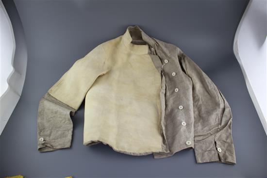 A late 19th century linen fencing jacket, with suede leather protect for body and arm for right handed fencer